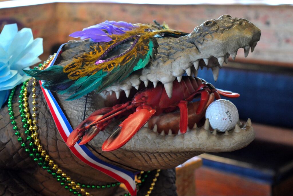 Angry Crab Franchise Crocodile with a Crawfish in Mouth