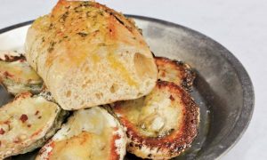 Angry-Crab-charred-oysters-covered-in-garlic-butter-and-parmesan-cheese